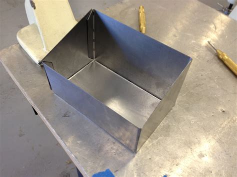 a metal worker is making a box|sheet metal box design template.